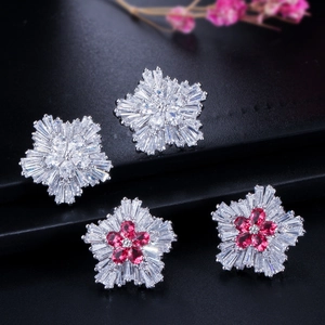 Elegant snowflake stud earrings with sparkling cubic zirconia stones in a floral star design