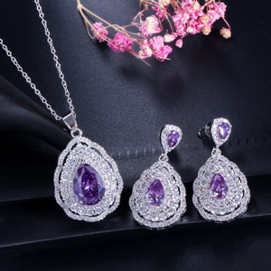 Detail of luxury teardrop purple zircon jewelry set with necklace and matching earrings