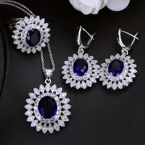 Detailed view of sunflower jewelry set featuring deep blue zircon and silver finish