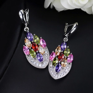 Detail of silver drop earrings with multi-colored marquise stones and tiny crystals