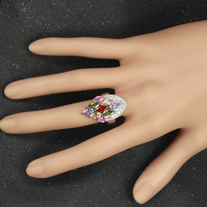 Detail of silver zircon ring featuring multi-color marquise gemstones in a radial setting