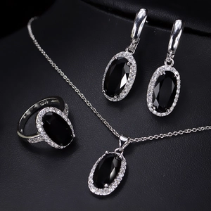 Close-up of S925 sterling silver stamp on halo set with black zircon stones