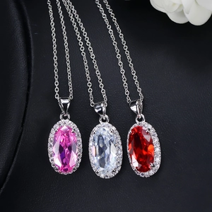 Elegant zircon bridal jewelry set featuring oval crystal pendants in pink, white, and red
