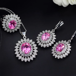 Sparkling pink sunflower jewelry set with silver necklace, ring, and earrings ensemble