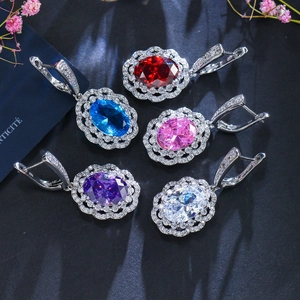 Detailed view of S925 sterling silver oval gemstone earrings in five vibrant colors