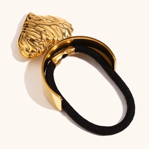 Minimalist gold textured heart pendant hair tie with a black elastic rubber band