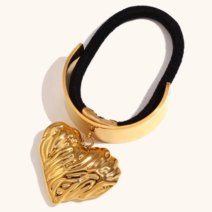 Minimalist black hair tie with 18K gold textured heart pendant and polished metal clasp