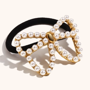18K gold plated stainless steel hair tie with a pearl-encrusted butterfly charm ornament