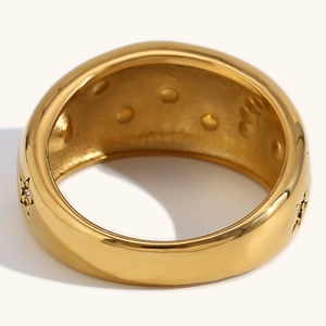 Hammered 18K gold-plated wide ring featuring star engravings and a textured inner band