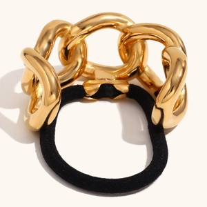 Macro shot of 18K gold plated thick chain links on black high-elastic hair tie cord