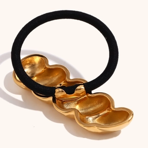 Minimalist 18K gold-plated twisted metal hair tie with high-elasticity black band