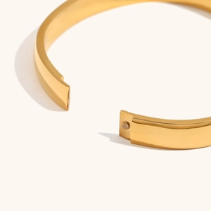 Polished 18K gold plated minimalist wide open bangle with a sleek mirror finish