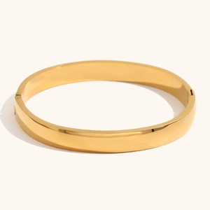 Minimalist 18K gold plated stainless steel wide bangle with polished finish and hinge clasp