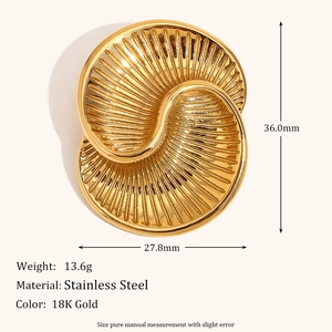 Macro view of 18K gold plated heart brooch with size specs and stainless steel texture