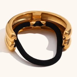 Detailed close-up of 18K gold plated double semi-circle hair ring with black elastic band
