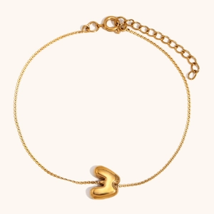 Detail of 18K gold plated chain bracelet with a puffy 3D letter B charm and lobster clasp