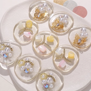 DIY resin hair clip charms with pearls, gold butterflies and sparkling rhinestones