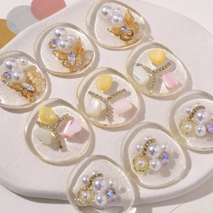 DIY craft charms with resin oval sequins and pearls for hair clips or shoe accessories