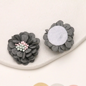 Detailed view of handmade 3cm dark grey microfiber daisy flower accessory for DIY hair clips