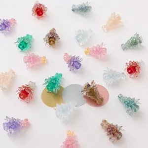 Macro detail of colorful transparent gradient Christmas tree resin beads for DIY jewelry