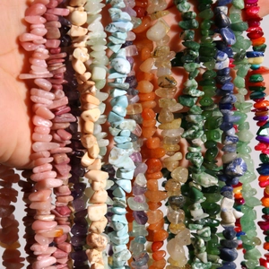 Macro shot of assorted colorful irregular polished natural stone beads for DIY jewelry