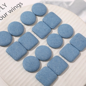 Light blue denim fabric covered round and square buttons for DIY garment accessories