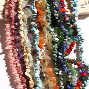 Macro shot of assorted irregular natural stone chips for jewelry making and DIY beads