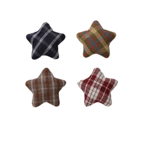 Set of four plaid fabric star-shaped DIY accessories in blue, brown, yellow, and red colors