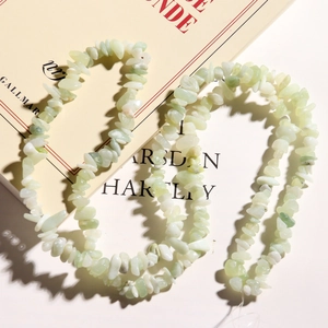Artistic layout of light green natural irregular stone chip beads for DIY jewelry