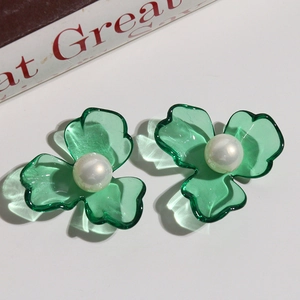 Green clover earrings with white imitation pearl center and transparent finish