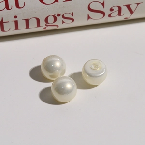 Macro view of 12mm iridescent mermaid faux pearl beads for DIY jewelry making and crafts