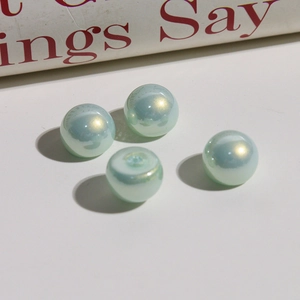 Detail of 12mm mermaid gradient faux pearls with aurora finish for DIY jewelry