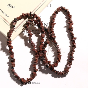 Detail of natural red jasper irregular stone beads strand for jewelry making