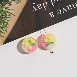 Detail of sweet cherry resin beads with pink yellow gradient for DIY jewelry making