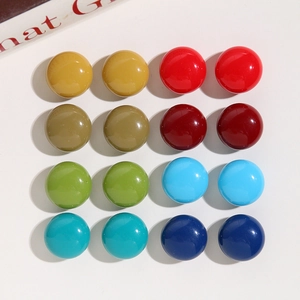 Flat lay of 8 pairs colorful 18mm resin dome cabochons for DIY earrings making