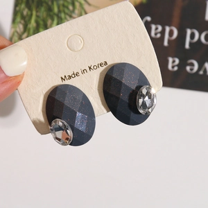 Oval black glitter resin stud earrings with diamond facets and clear crystal teardrops