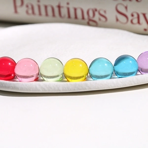 Macro shot of 14mm colorful clear jelly resin round beads for DIY jewelry and hair accessories