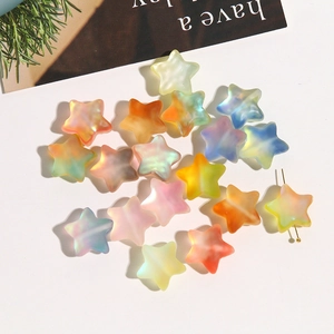 Macro shot of colorful matte star beads with iridescent gradient for DIY jewelry