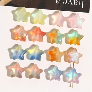 Macro view of matte star-shaped frosted acrylic beads with rainbow gradient finish