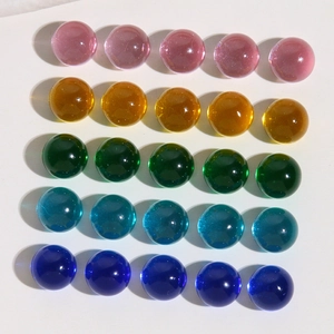Macro detail of 10mm colorful transparent resin beads for DIY jewelry and hair accessories