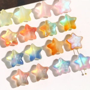 Macro shot of colorful matte gradient star beads for DIY jewelry and necklaces