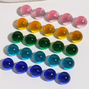 Macro shot of 10mm colorful translucent resin round cabochons for DIY jewelry making