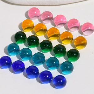 Macro shot of 10mm colorful translucent jelly resin round cabochons for DIY crafts