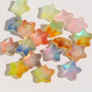 Macro shot of candy-colored gradient matte star beads for DIY jewelry and crafts