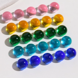 Macro detail of 10mm colorful transparent resin beads for DIY jewelry making