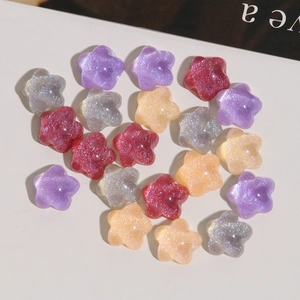 Macro shot of colorful glitter resin star charms for DIY jewelry and nail art