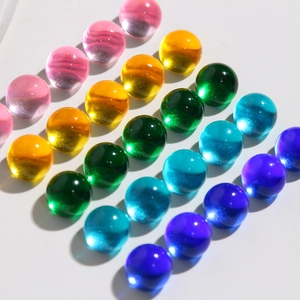 Macro shot of 10mm colorful translucent jelly resin cabochons with cat-eye glitter effect