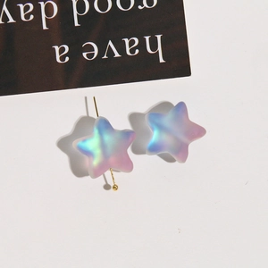 Macro shot of colorful gradient matte star beads with laser iridescent finish for DIY jewelry