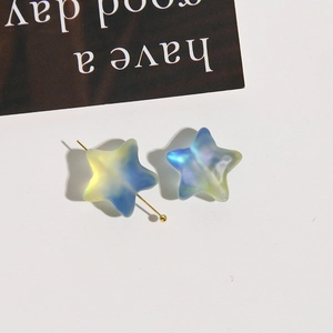 Macro detail of gradient frosted star beads with aurora effect for DIY jewelry making