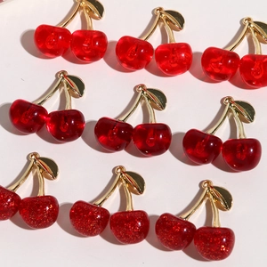 Sparkly glitter and translucent cherry pendants with gold leaves for DIY jewelry making